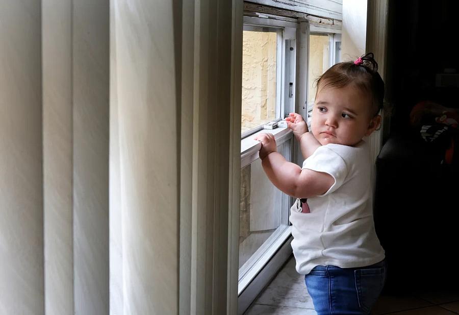 Image of a child by the window