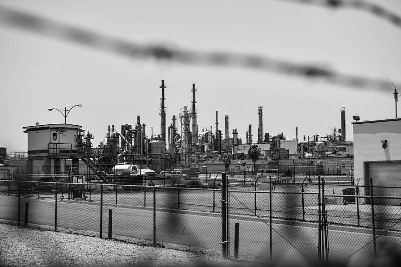 The Phillips 66 refinery looms from the distance in Wilmington, California. Pablo Unzueta