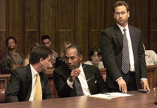 OJ Simpson, flanked by lawyers.