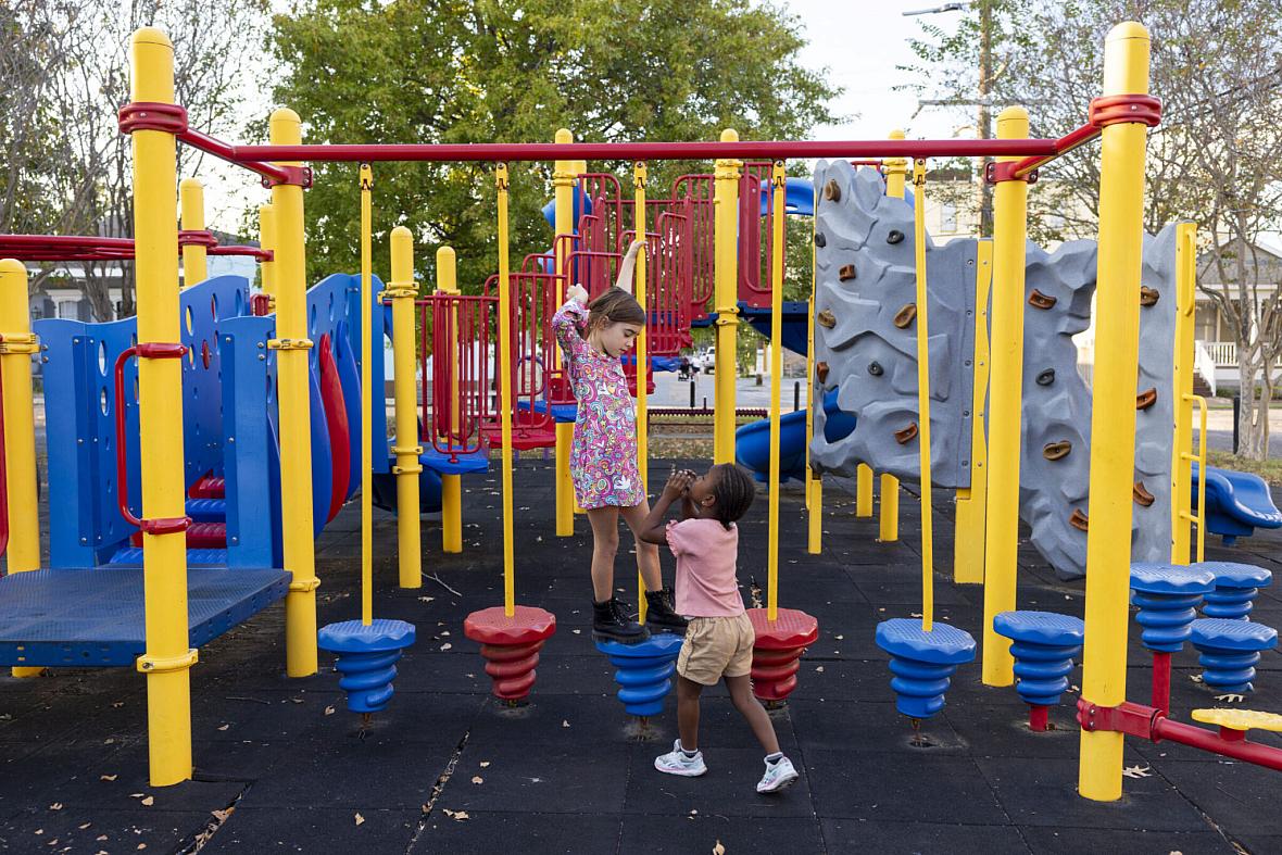 Ruthie, 7, left, and Justice, 6, play on the equipment at Soraparu Playspot 