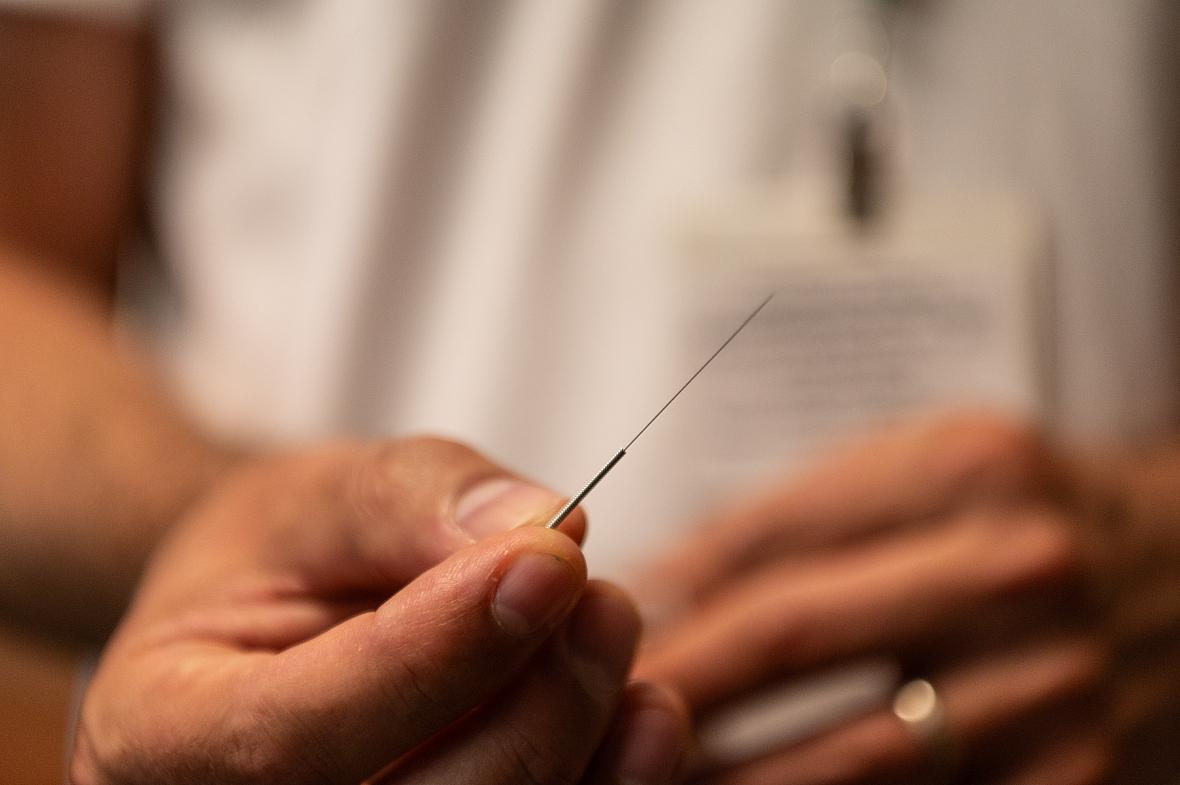 A hand with a needle