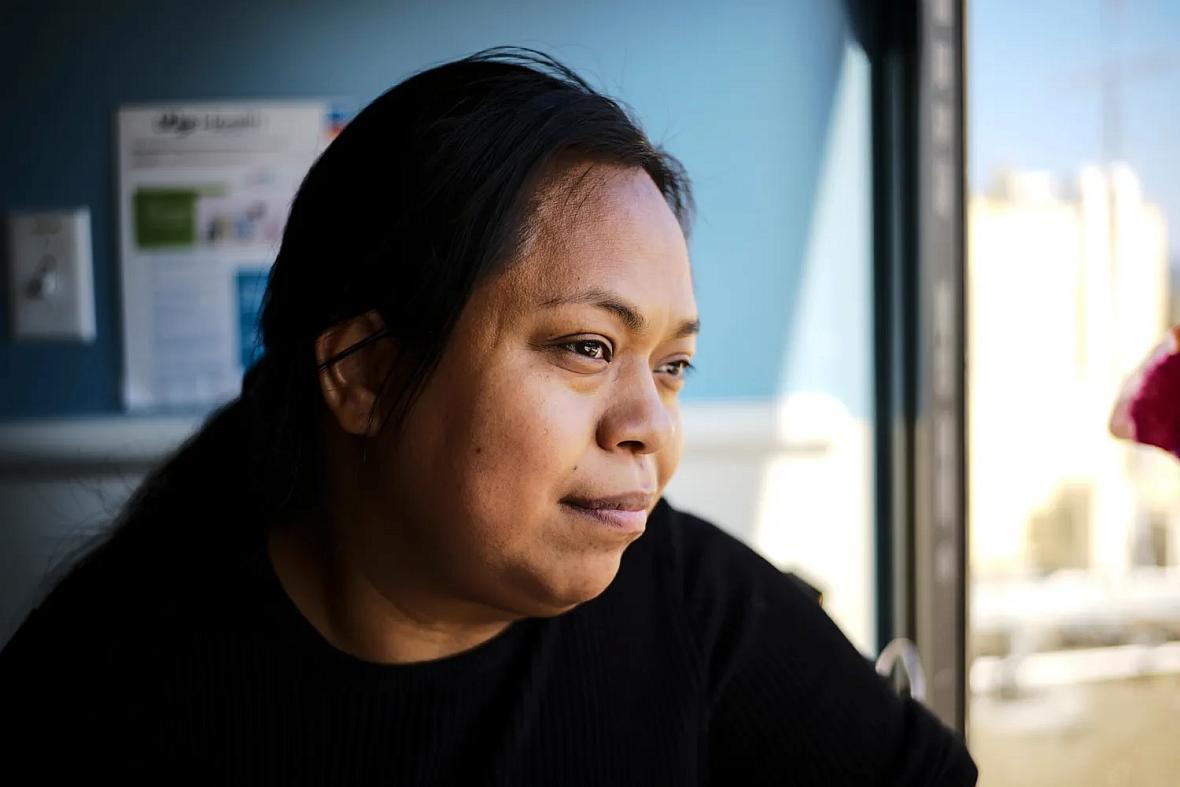 a woman staring out the window