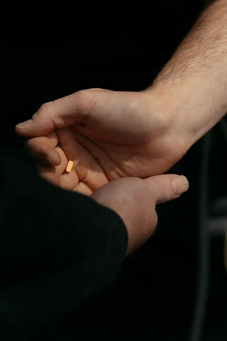 handing pills