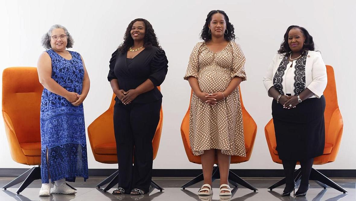 Four women standing 