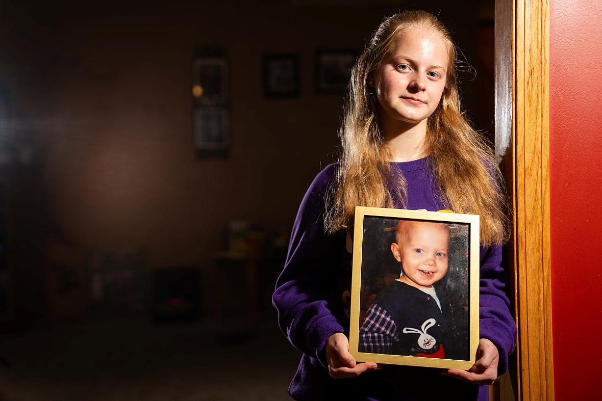 A person holding a photo frame