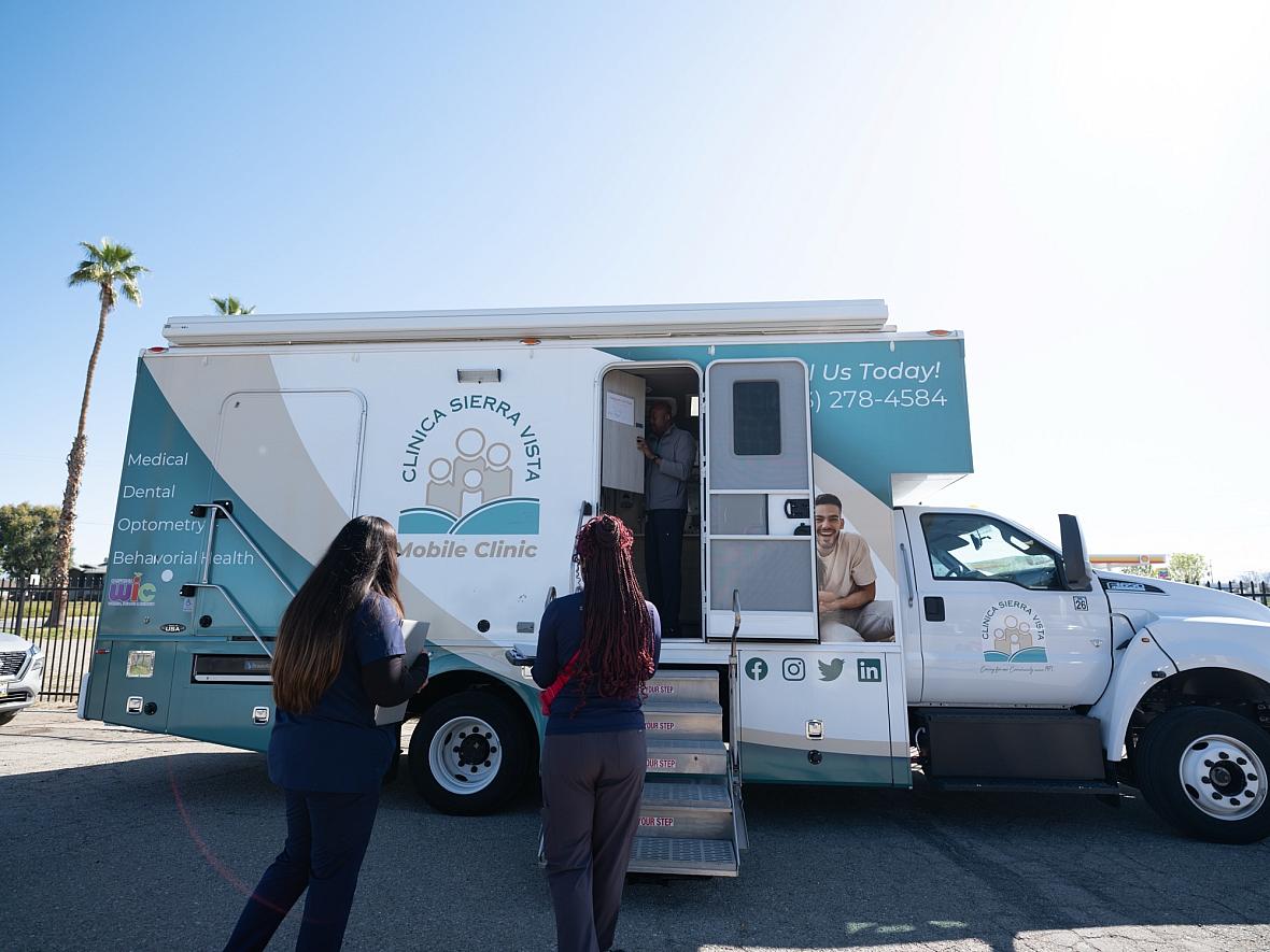 Folks wait to enter Clinica Sierra Vista's Mobile Clinic