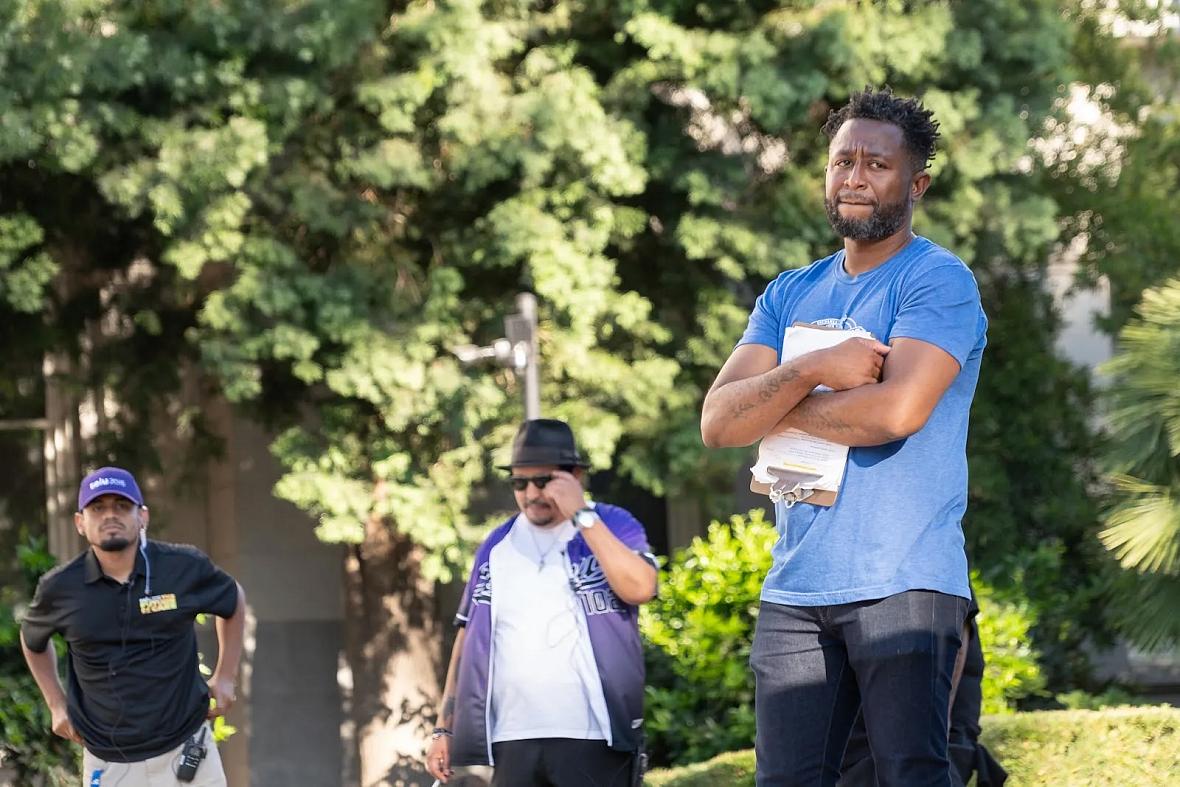 A man with others in the background