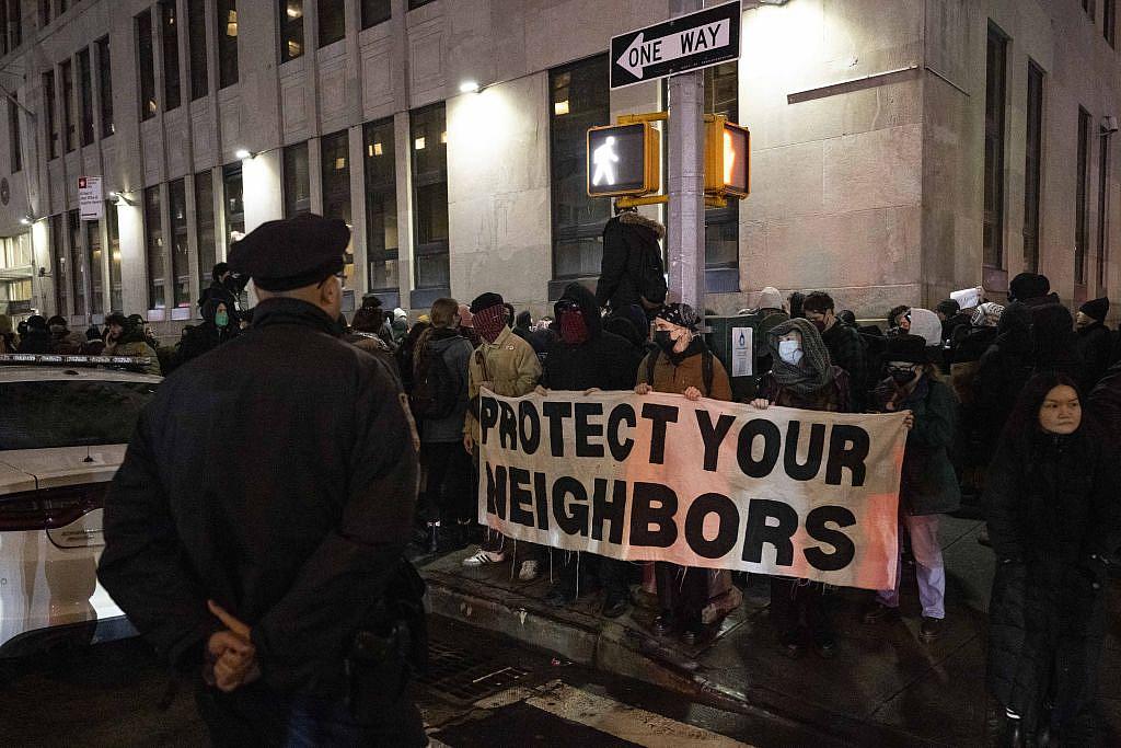 People holding a sign