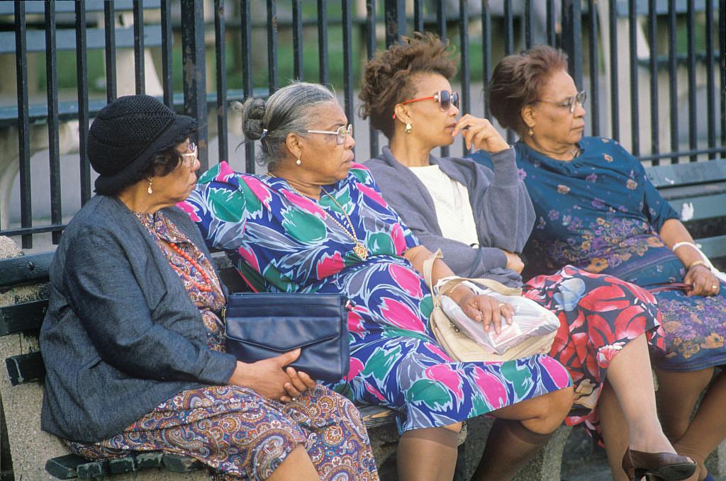 Four women on a park bench