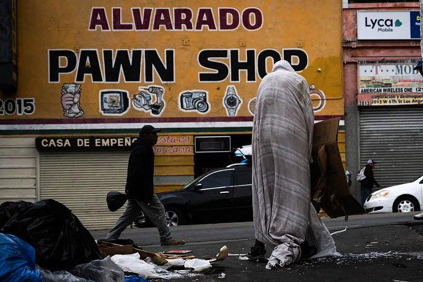 Image of homeless people on street.