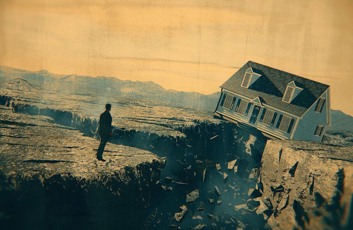 Person standing on the edge of a cliff with a house in the background