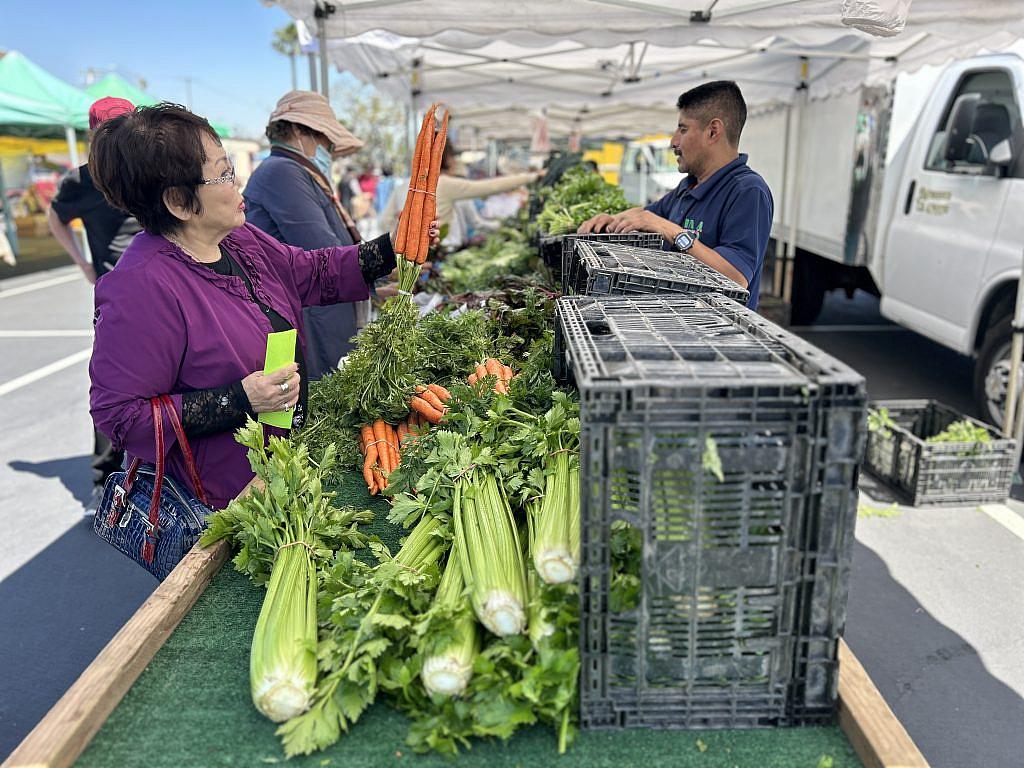 Woman at a vegetable stand