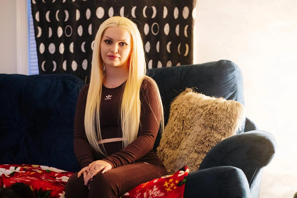 Person seated on a couch