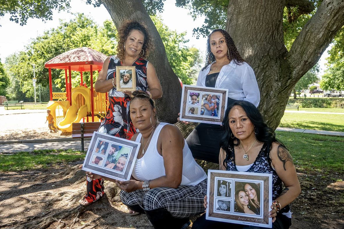 4 people holding photo frames