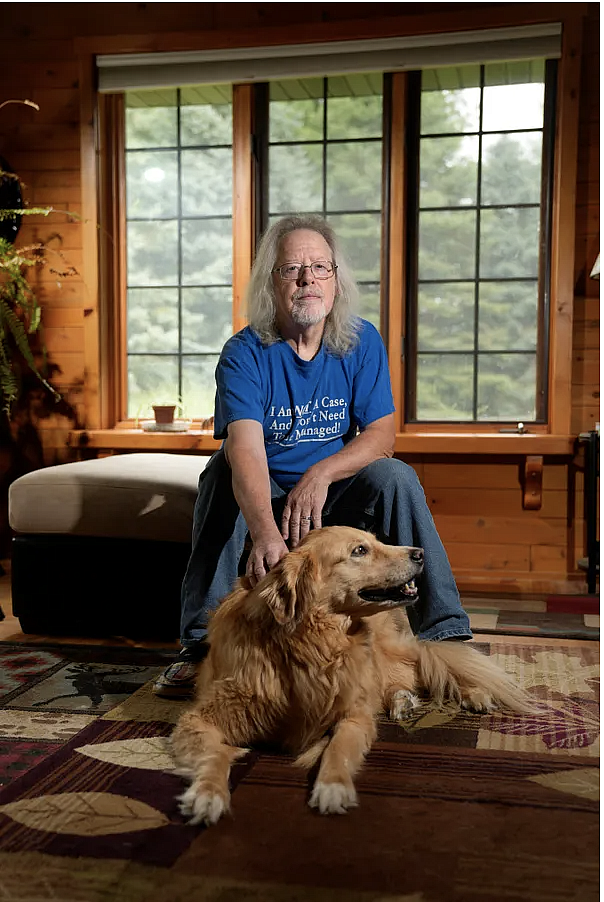 Person seated with a dog