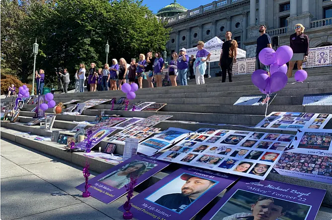 Posters and balloons laid out on steps