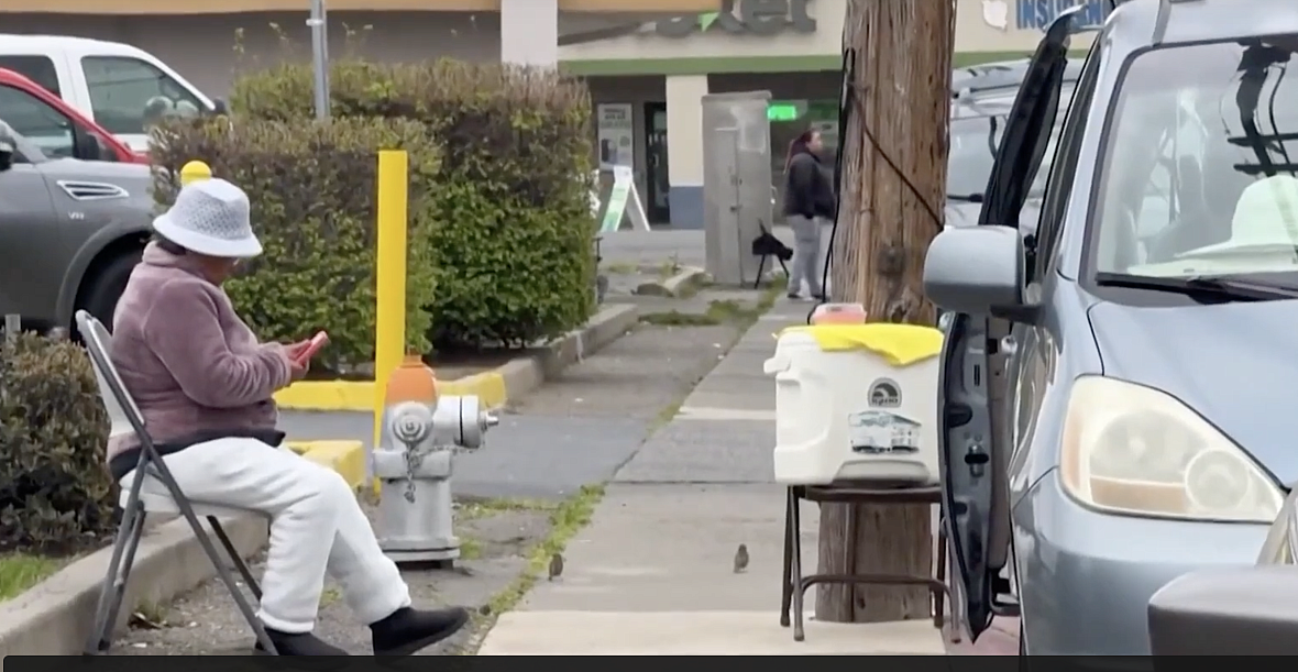 Woman sitting on street