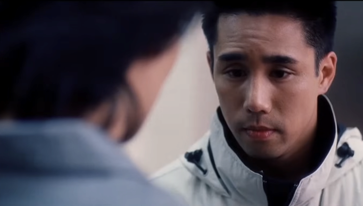 A tight shot from the film Better Luck Next Time shows two Korean high school students talking