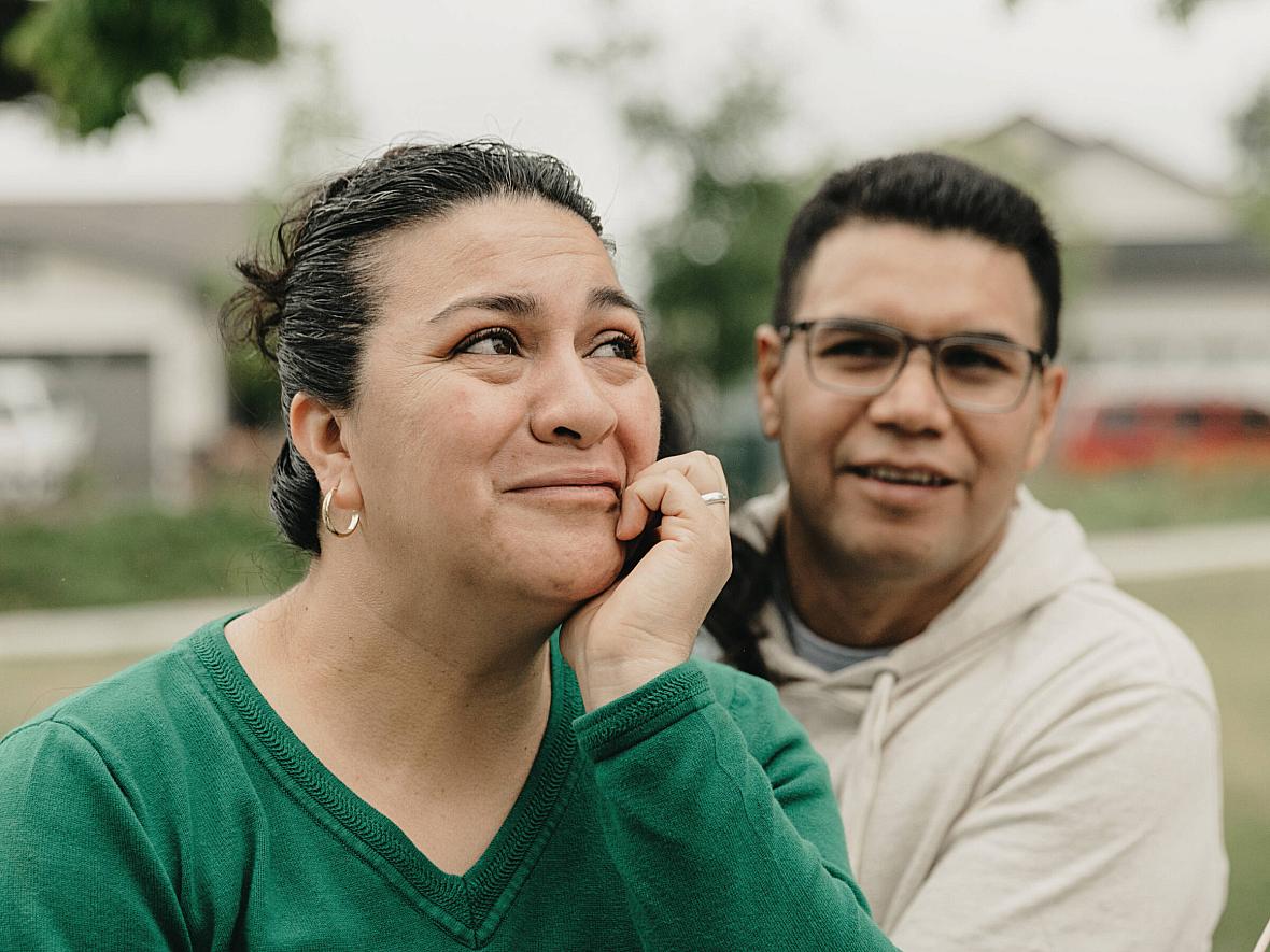 Image of a man and woman in lawn posing for the camera