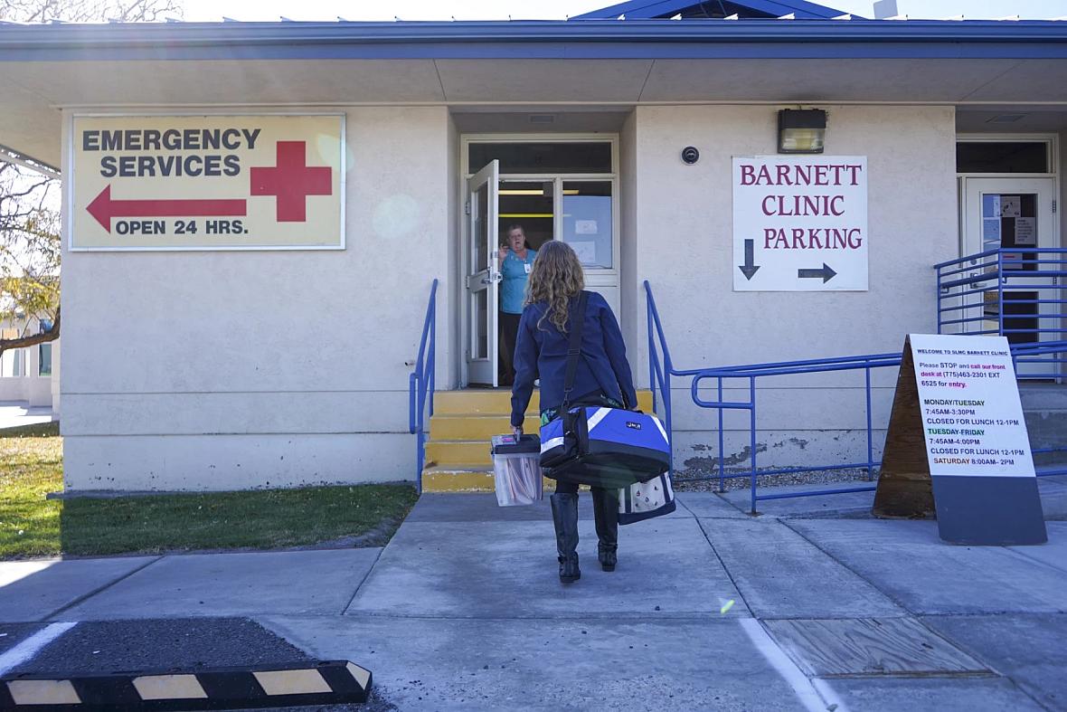 Image of a person walking into Emergency Services