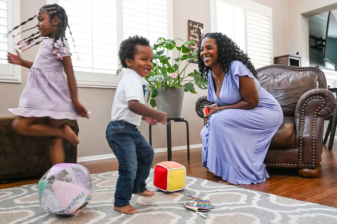 Person and children playing