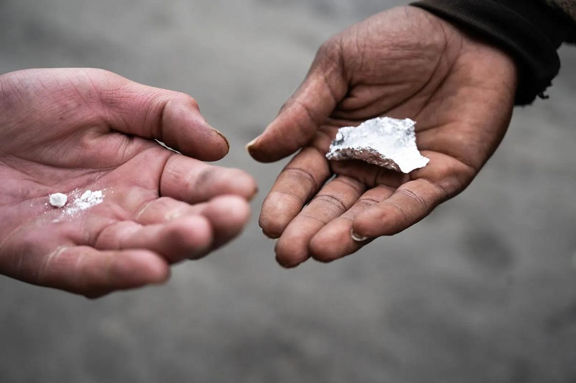 Image of a person's hand with white substance on it