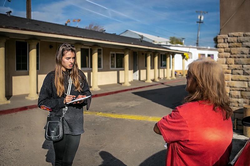 A reporter interviewing lady