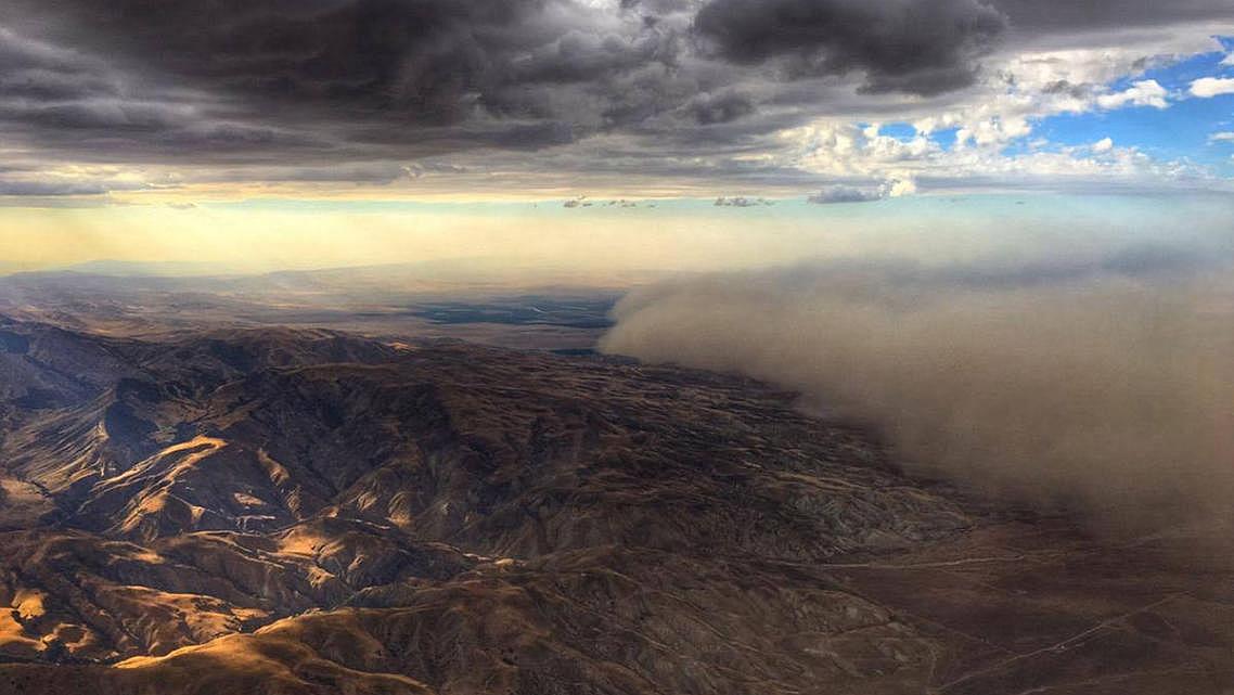 Dust storms, like this one in Fresno, can help distribute the fungal spores that cause valley fever. (Craig Kohlruss/Fresno Bee)