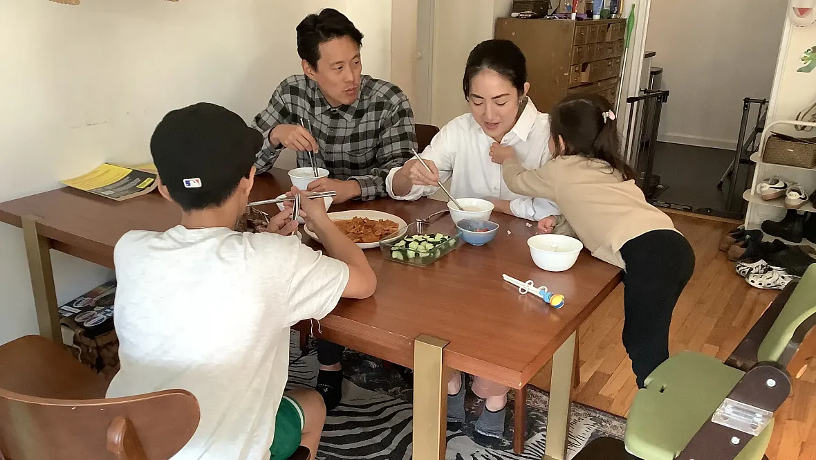 Family photo at dinner table, while having a meal
