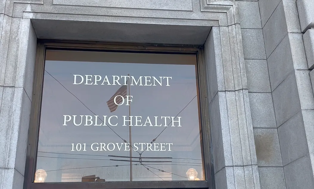 A window with text, department of piblic health 101 grove street