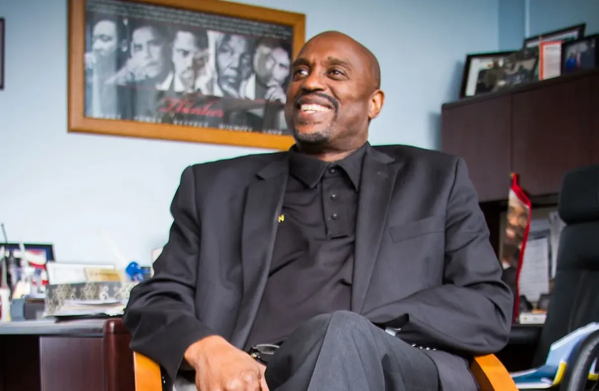 A person in a black suit