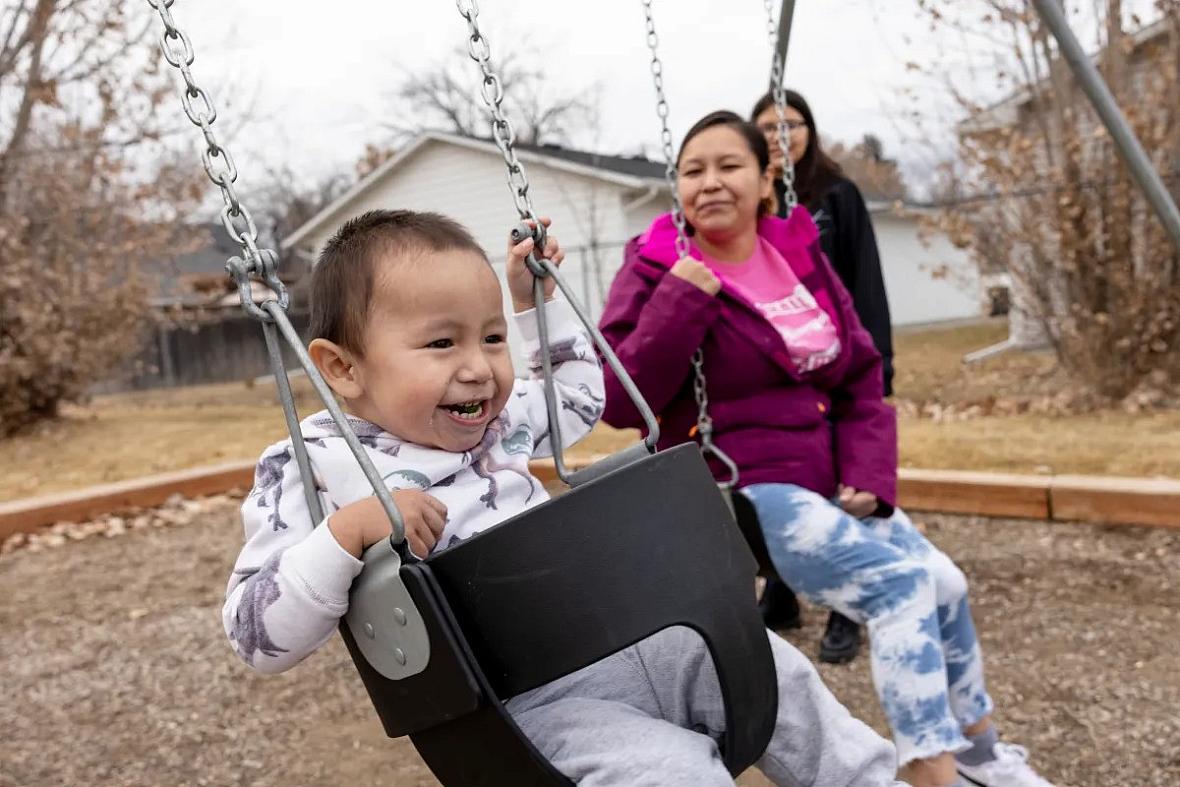 Image of child playing on swing