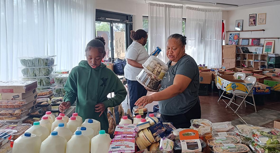 A woman and a girl sorting food