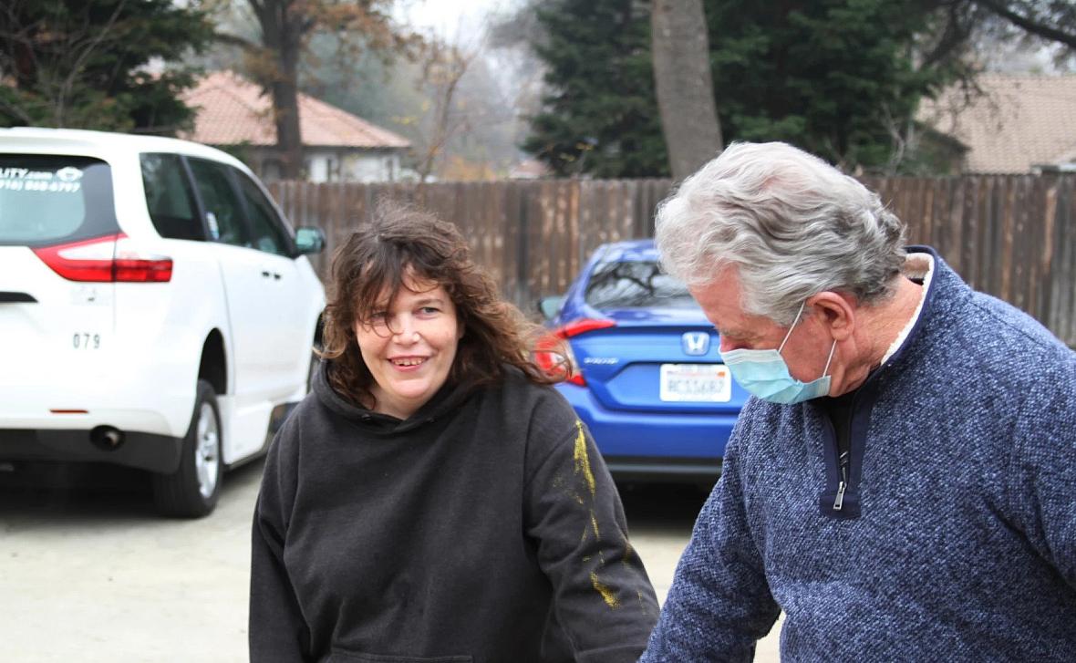 A woman walking with her father