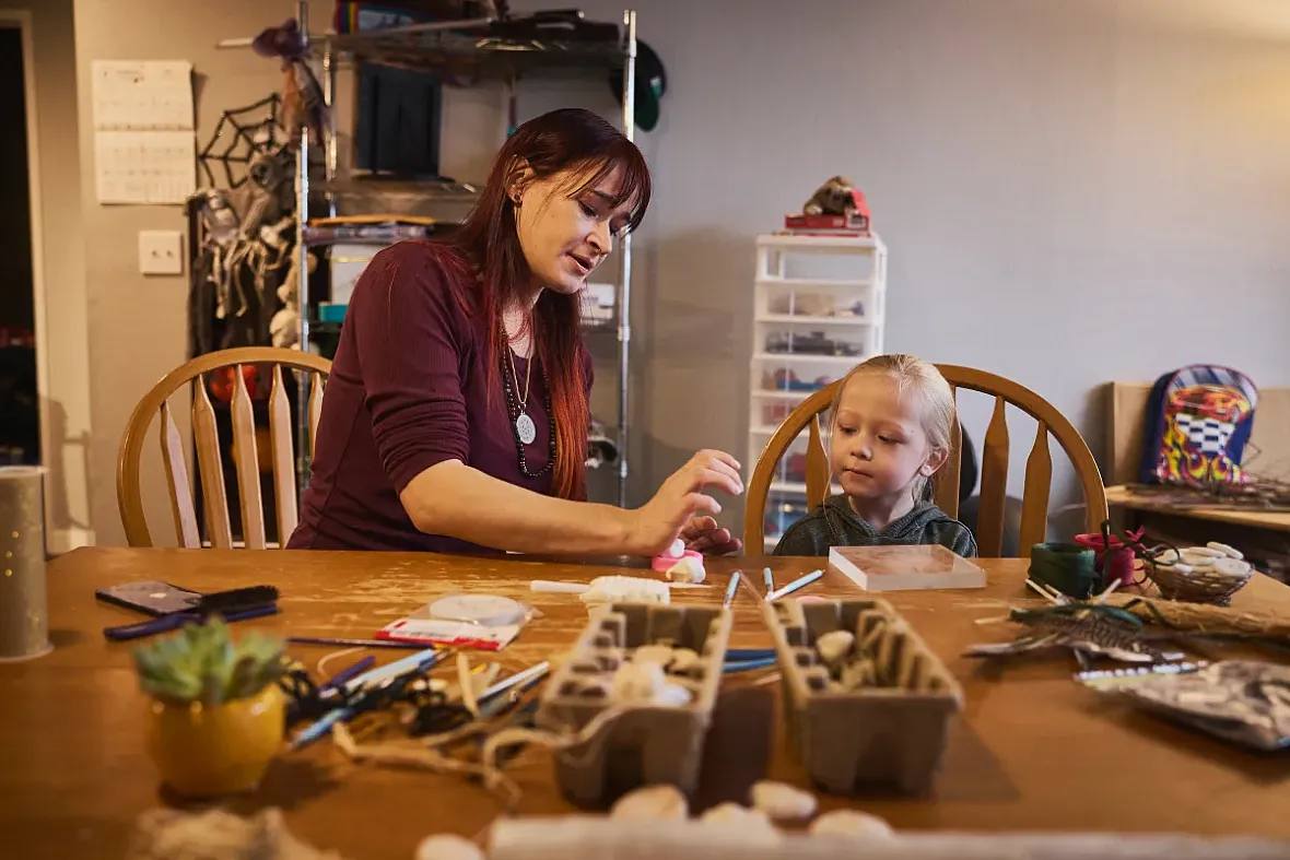 A person and a child at a table