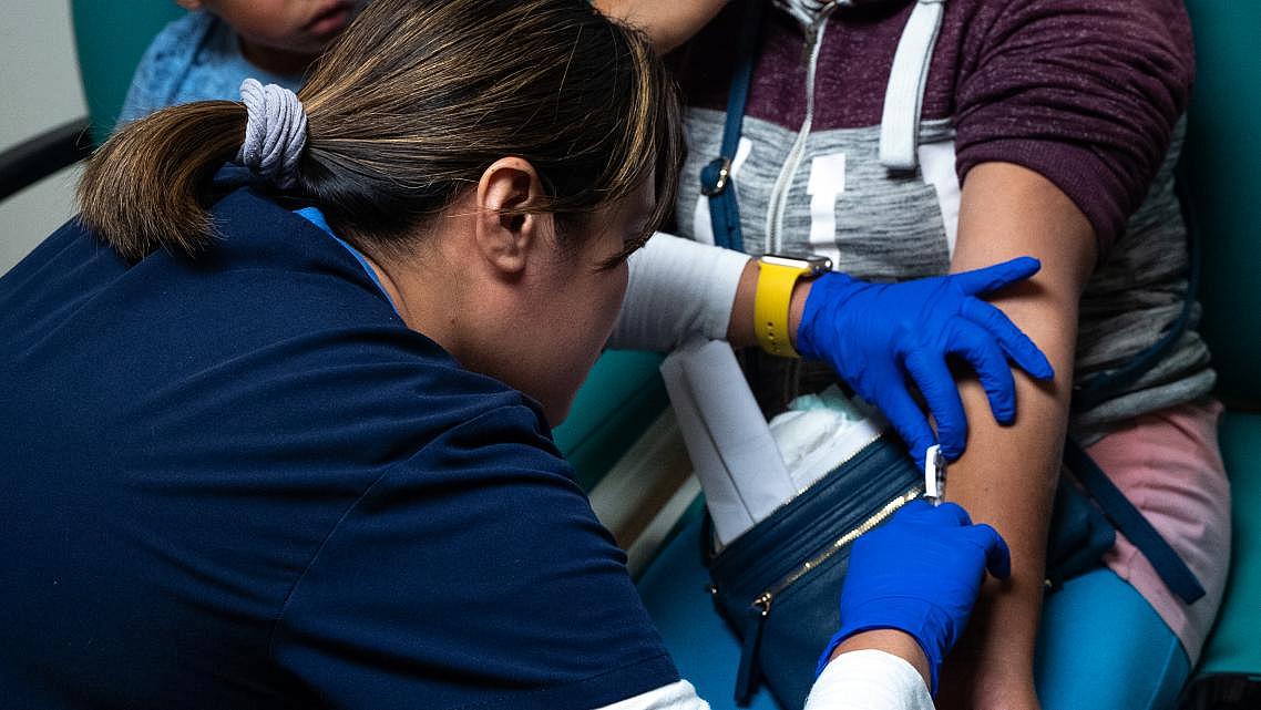 During a checkup in November 2019, Abraham and his mother, Magdalena Gonzalez, received a skin test from nurse Jackylou Cortez to evaluate how their bodies react to the fungus that causes valley fever. (Credit: UCLA)