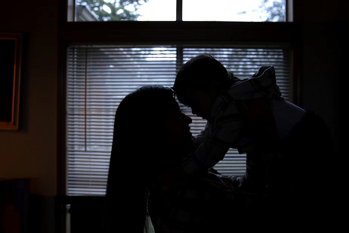 A person playing with a child