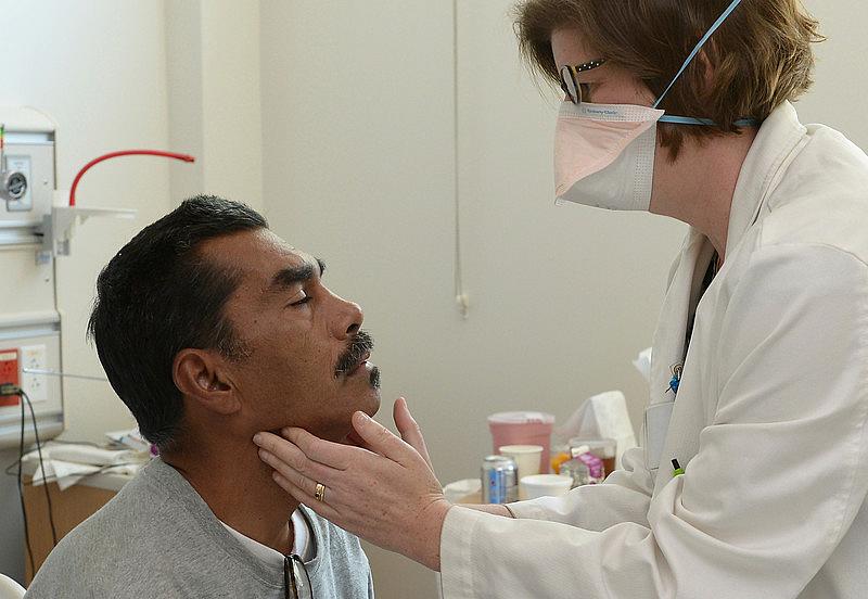 Tuberculosis patient Joe Ordaz is examined by Dr. Caitlin Reed at Olive View Medical Center in Sylmar. The hospital houses one of only four tuberculosis centers of its kind in the nation and is one of few that can quarantine and treat individuals with drug resistant TB. (Photo by John McCoy/Los Angeles Daily News) Tuberculosis patient Joe Ordaz is examined by Dr. Caitlin Reed