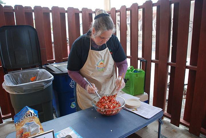 Rose Brown makes pico de gallo at Pacific Pantry's one-year anniversary celebration in May.