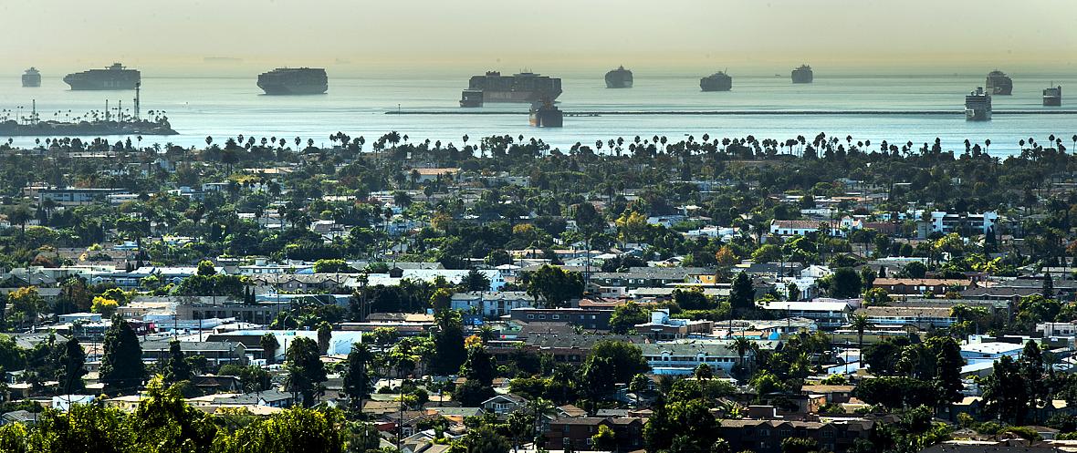 Several cargos ships wait outside of the breakwater as they wait for their turn to enter the ports from Signal Hill Friday, Oct.