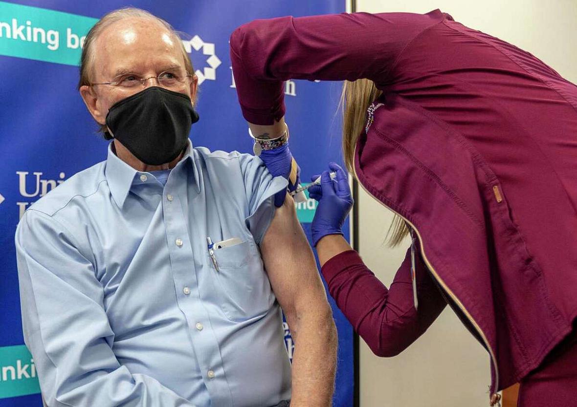 Bexar County Judge Nelson Wolff receives his COVID-19 vaccination Wednesday, Dec. 30, 2020 at University Hospital from medical a