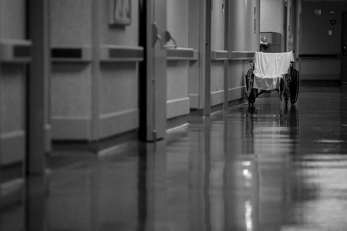 An empty wheelchair is seen in the hallway at Texas Vista Medical Center in San Antonio, Texas, on Oct. 26, 2021.