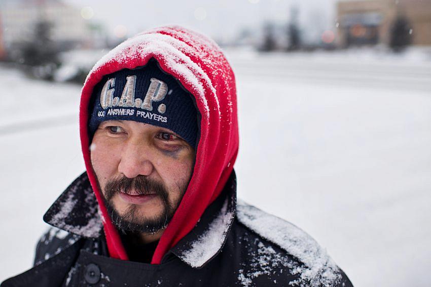 Marc Lester / ADN Albert Edwards panhandles at the entrance to Walmart on Benson Boulevard. He said he has been homeless for five years.