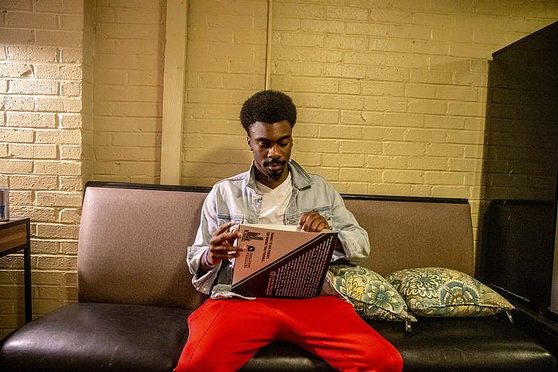 Tye Harris opens his Central Track Music Honor vinyl record at the Granada Theater in Dallas.