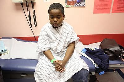 John Fitzpatrick awaits his appointment during his monthly asthma clinic at Children's Hospital Oakland in Oakland, Calif., on T