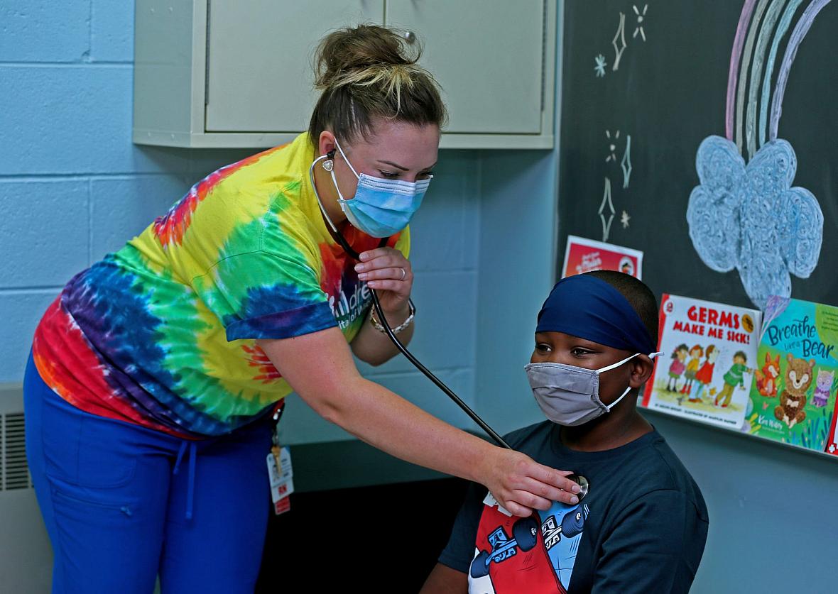 Starms Discovery Learning Center school nurse Ashley Capodarco exams student Major Wilson, 9, in her office. Asthma is the most common disease Capodarco sees at the school. Starms Discovery Learning Center school nurse Ashley Capodarco exams student Major Wilson, 9, in her office. Asthma is the most