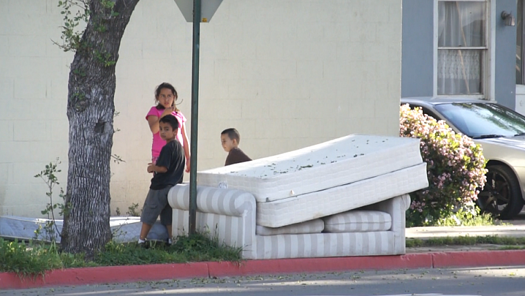 Children play on a street corner in central Santa Ana. Children play on a street corner in central Santa Ana.