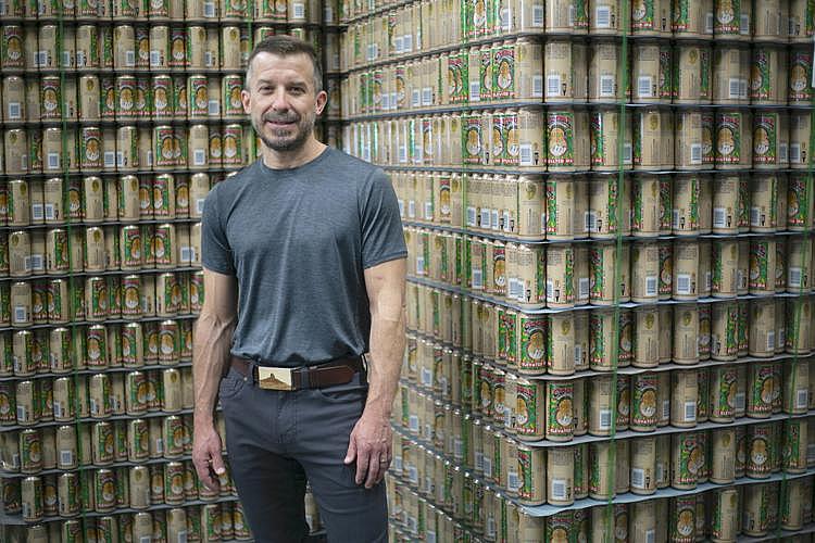 Brewer Jeff Erway stands next to his signature beer, Elevated. La Cumbre Brewing Co. is one of New Mexico's largest craft beer c