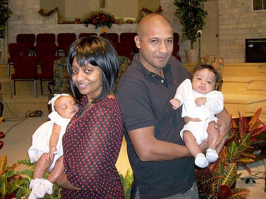 Latrelle Huff, left, is shown with her former boyfriend and their twins at the babies' baptism in 2014. 