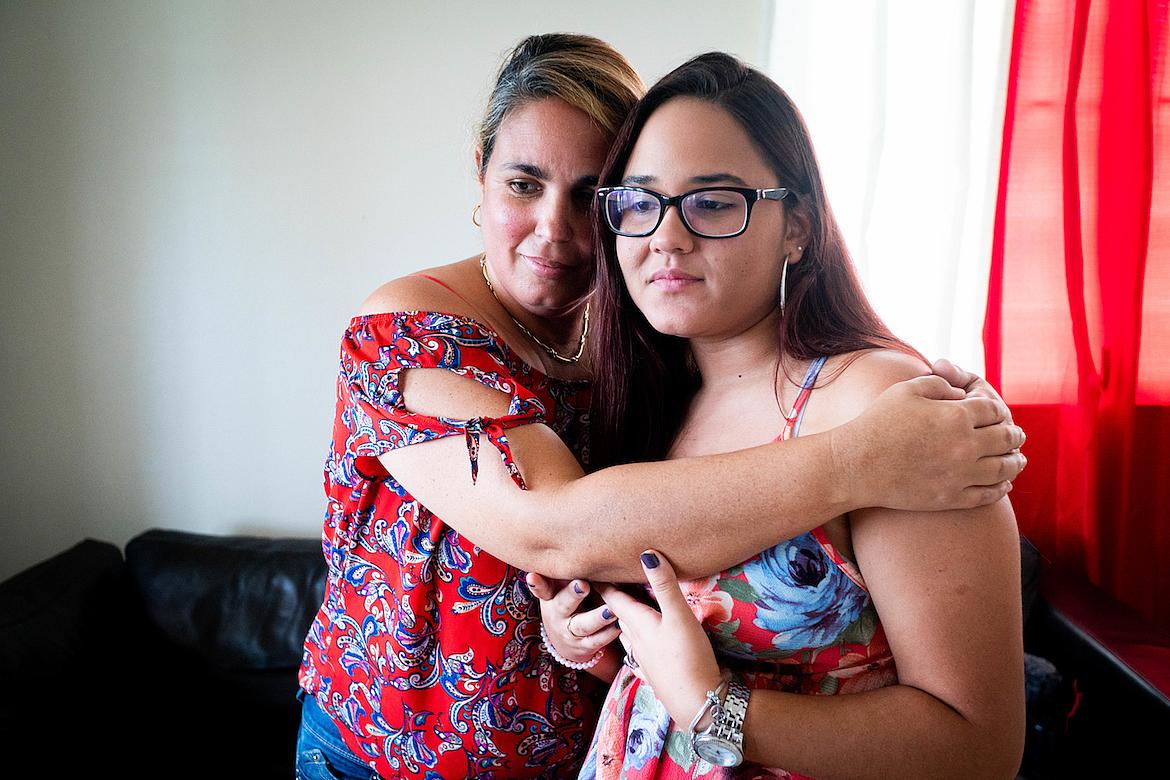 Karoline Vázquez Díaz and her mother, Brenda Diaz embrace in their home in Morovis.